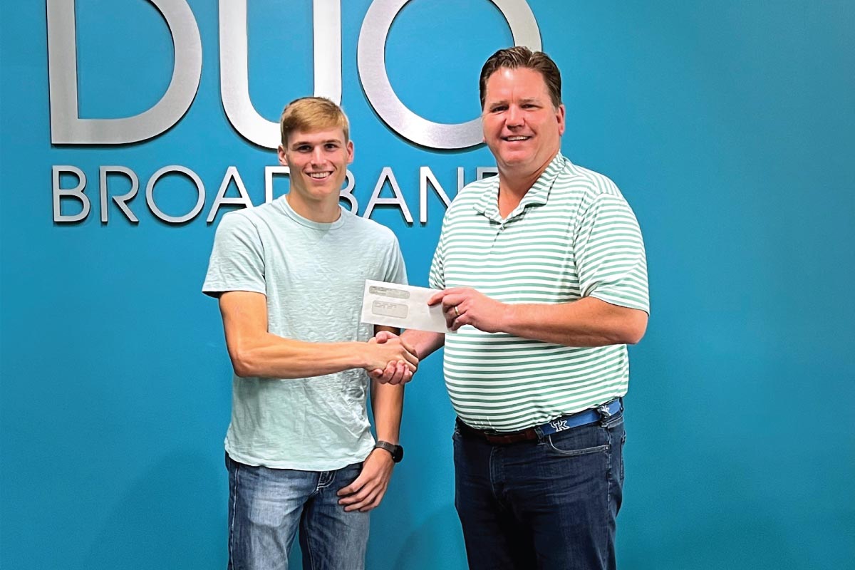 DUO Broadband CEO Tom Preston awards a scholarship to Gauge Logan-Key