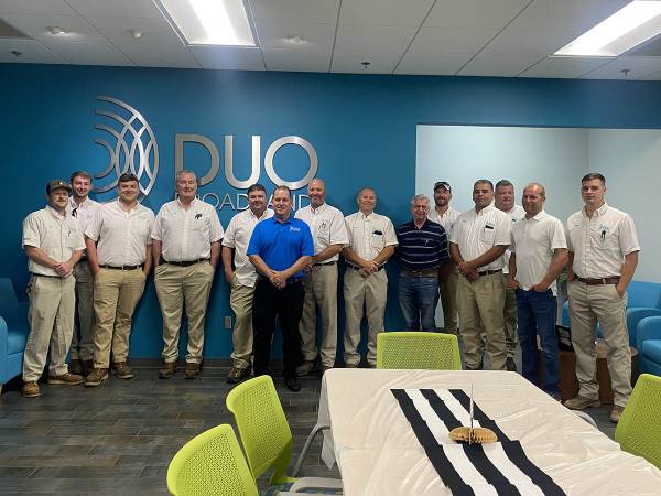 Paul Coffey with DUO Broadband employees