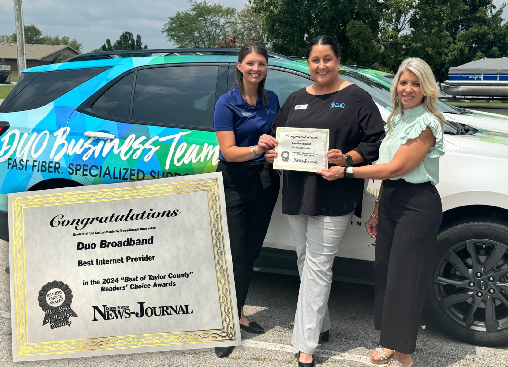 Photo illustration of three women standing outside next to an SUV with bright graphics holding a certificate, with an image of a Best Of Taylor County certificate in the foreground