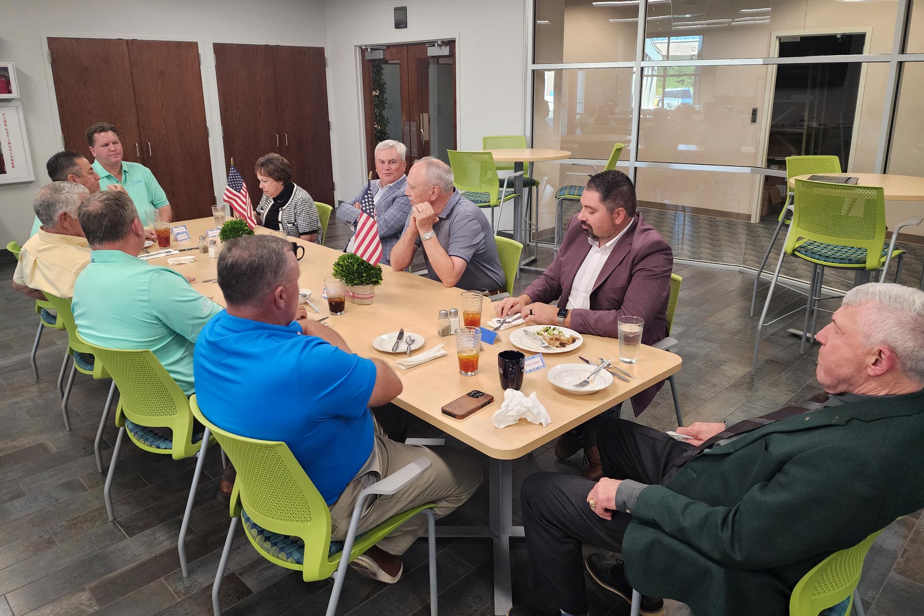 Group of people at a dinning table talking