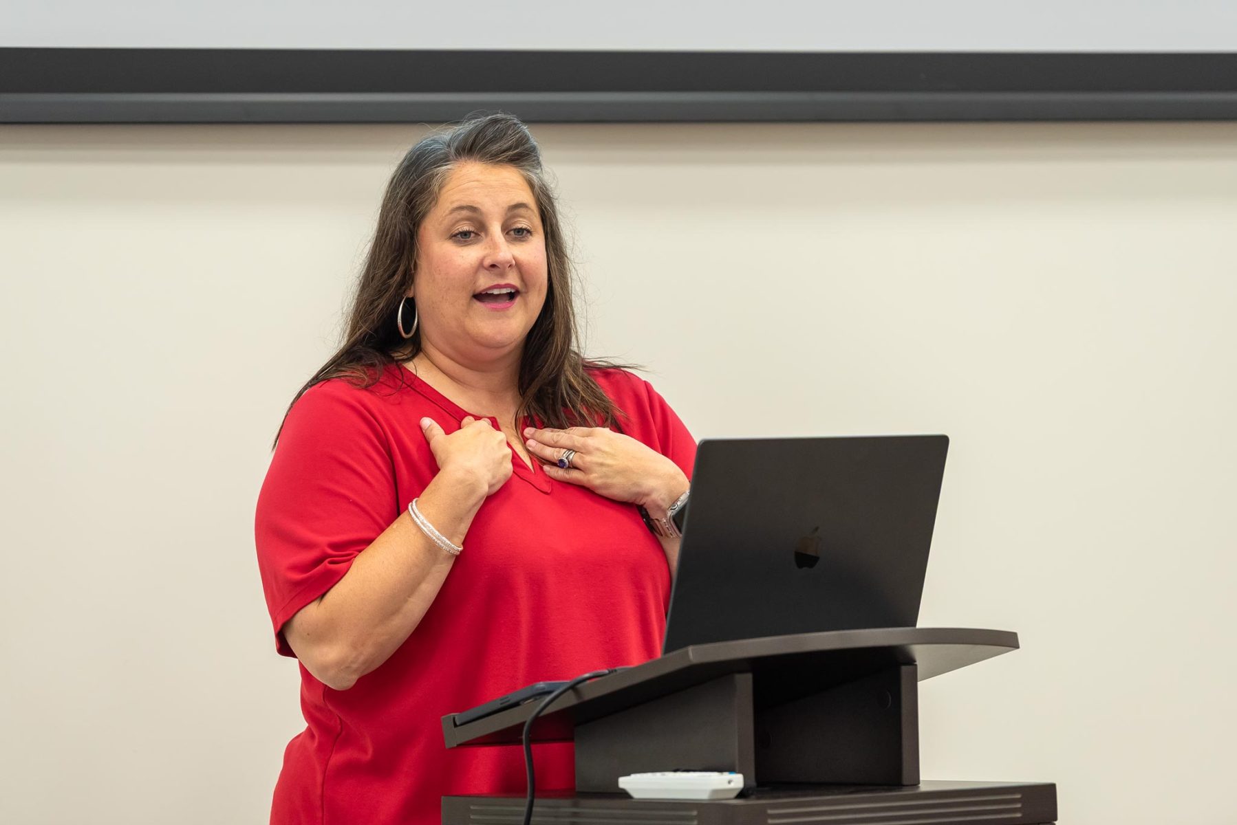 Woman talking at a podium