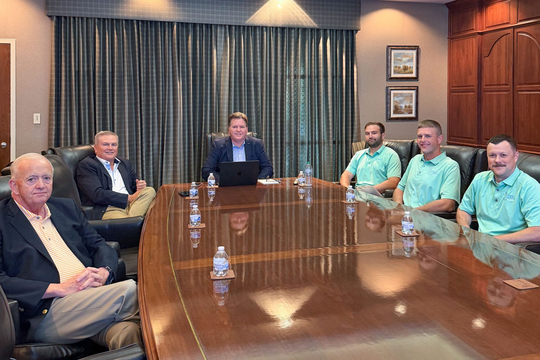 Group of people in a board room